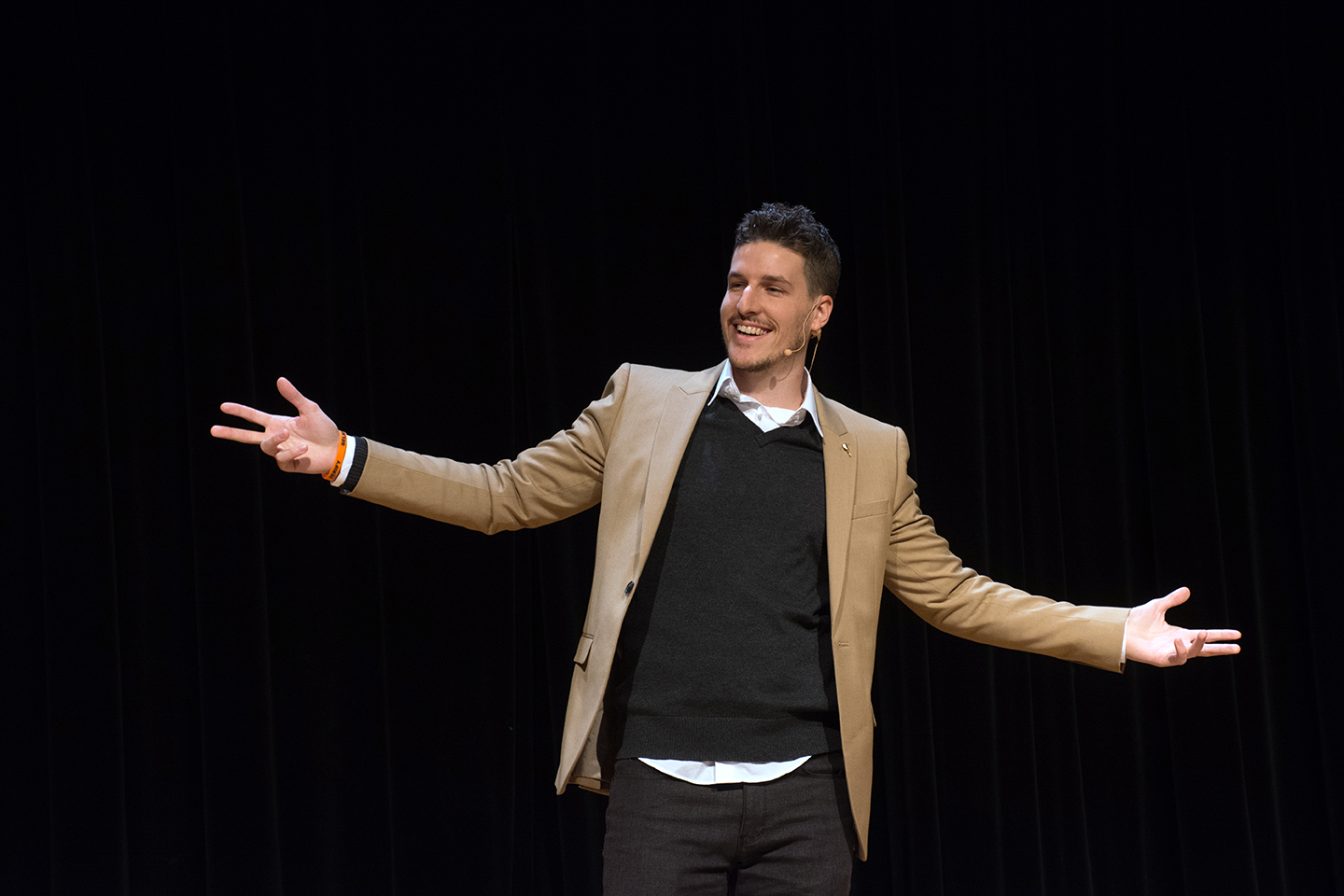 Guillaume speaking on stage